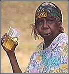 Aborigine woman with a beer